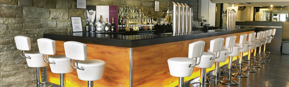 Illuminated bar counter with fixed bar seating in White